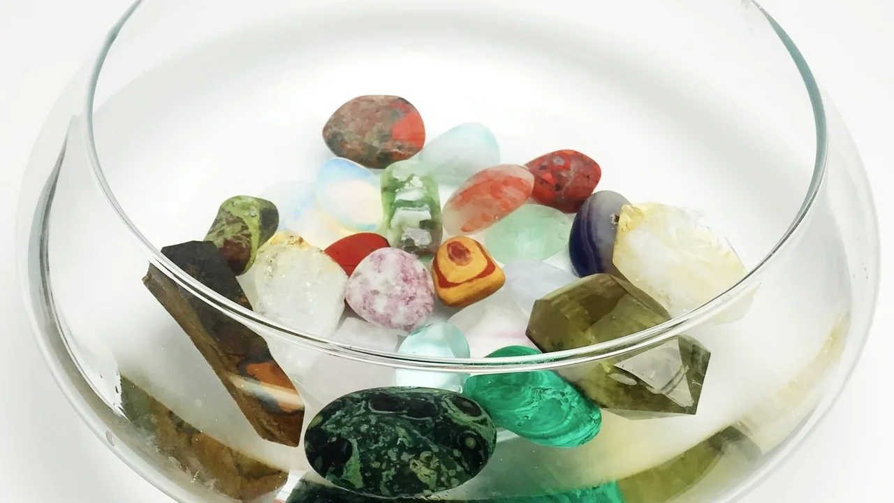 Two mint chocolate milkshakes with whipped cream and green sprinkles.